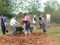 St. Michael's School students help spread woodchips