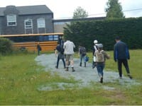 St. Michael's School students head back towards a schoolbus.